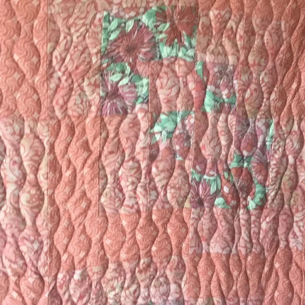 NWT. Hand Crafted Quilt in Corals